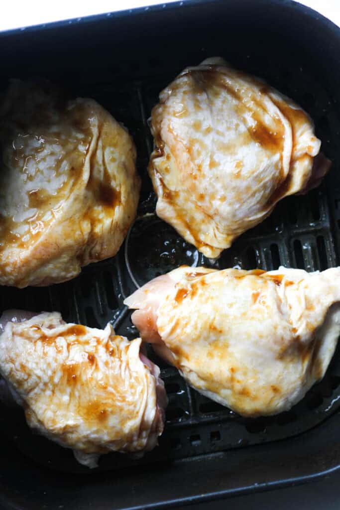 marinated poultry pieces in black basket