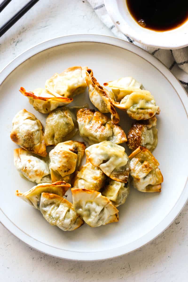 air fryer bibigo mini dumplings on the white plate