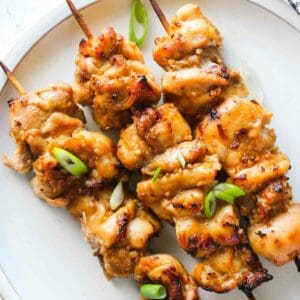 air fryer chicken yakitori on the plate with chopped green onions on top