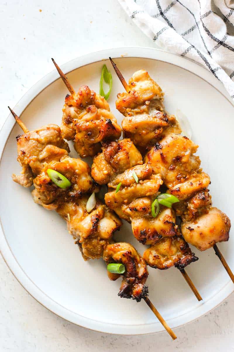 air fryer chicken yakitori on the plate with chopped green onions on top