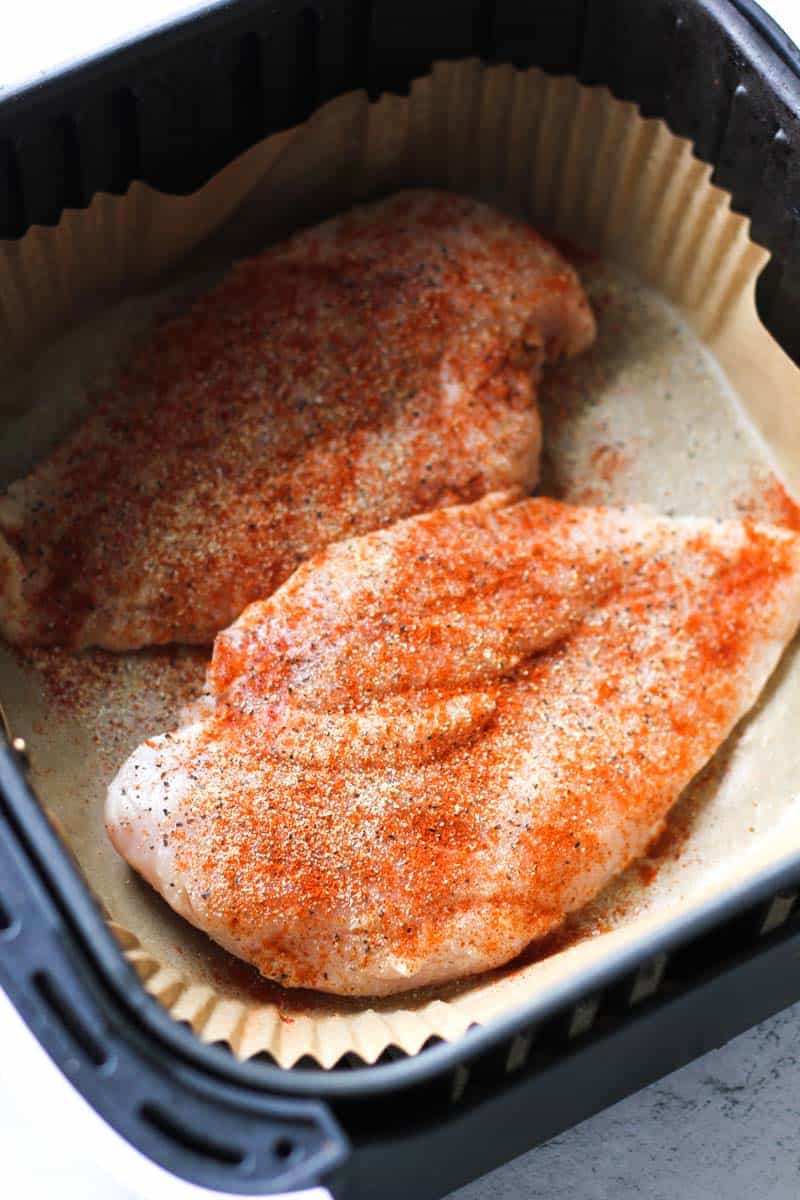 seasoned raw whole chicken breasts in the air fryer