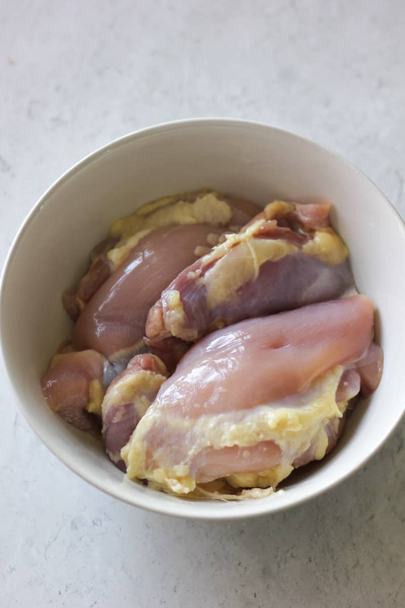 raw poultry in the white bowl