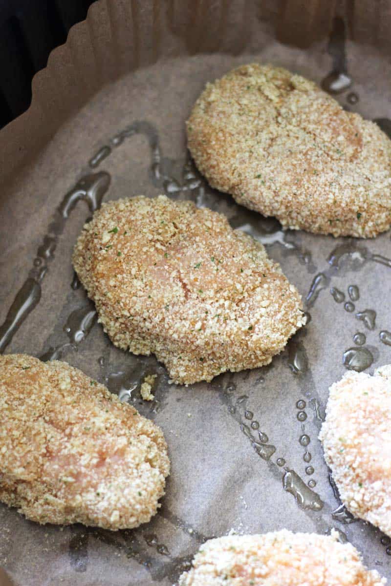 raw chicken nuggets in the air fryer basket