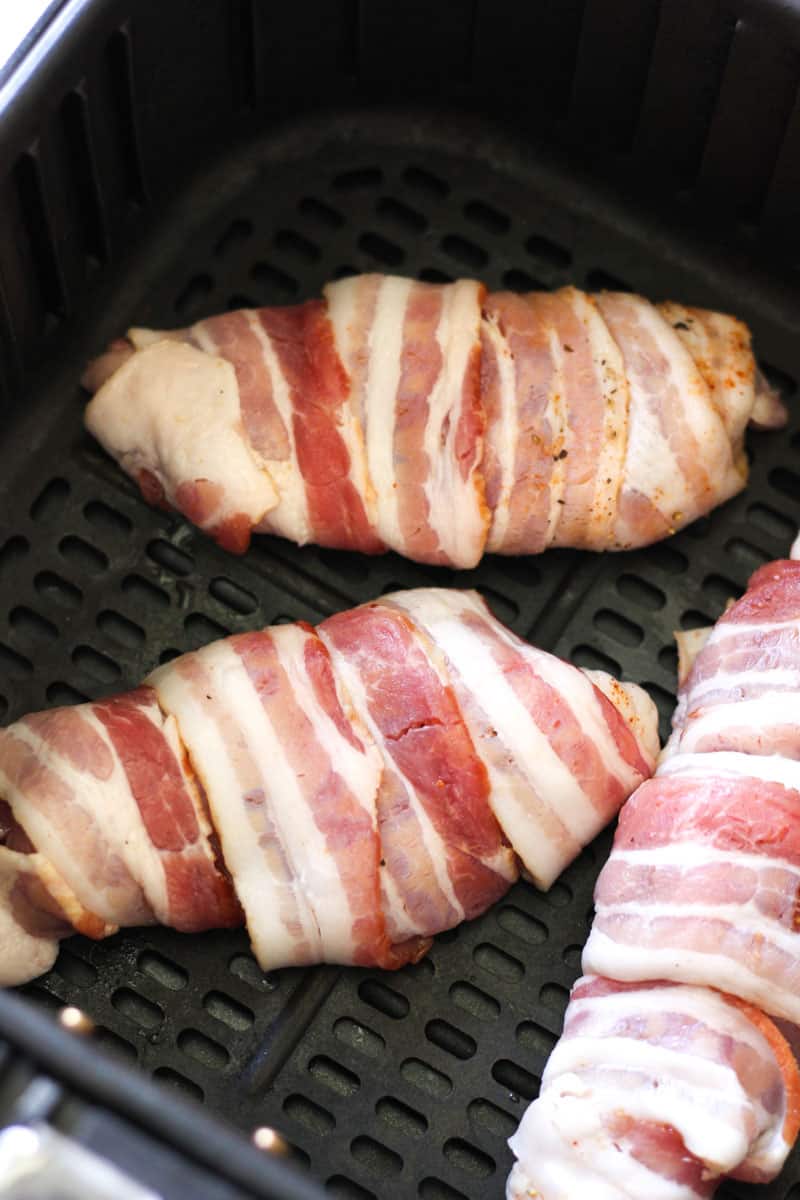 raw bacon wrapped chicken thighs before cooking