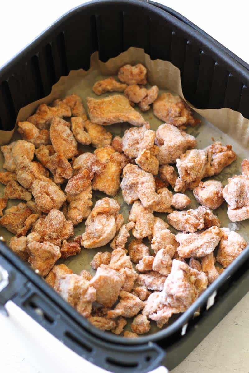 raw chicken pieces in the air fryer