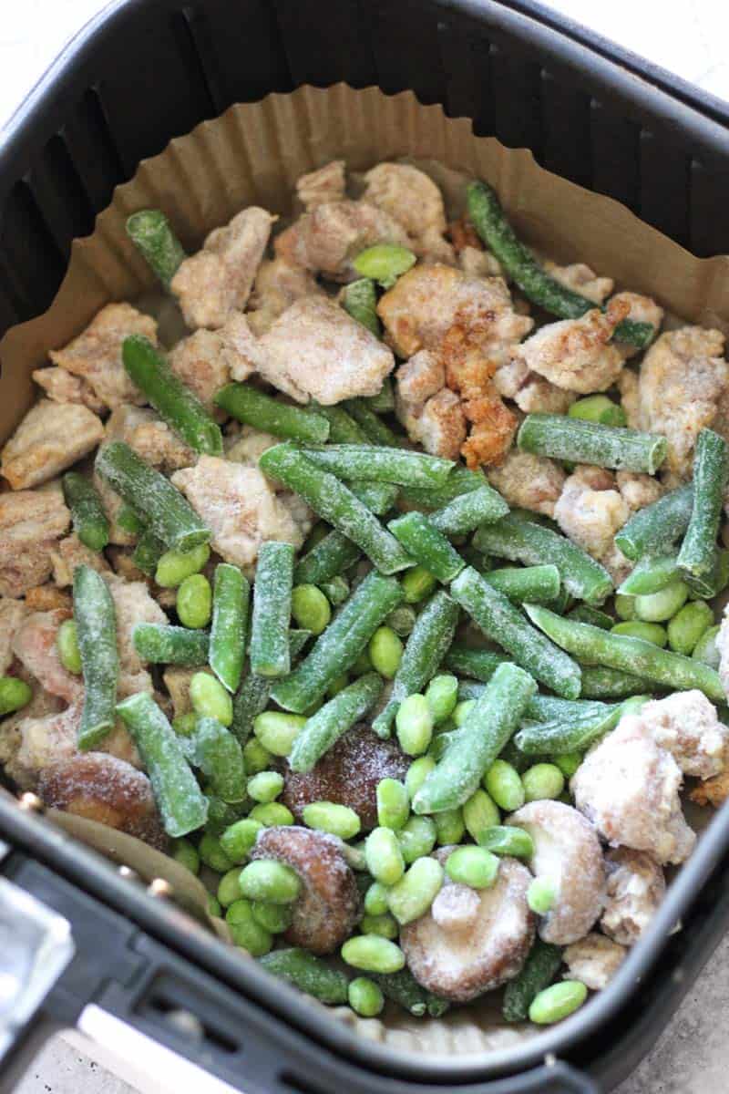 frozen green beans on top of mushrooms in air fryer