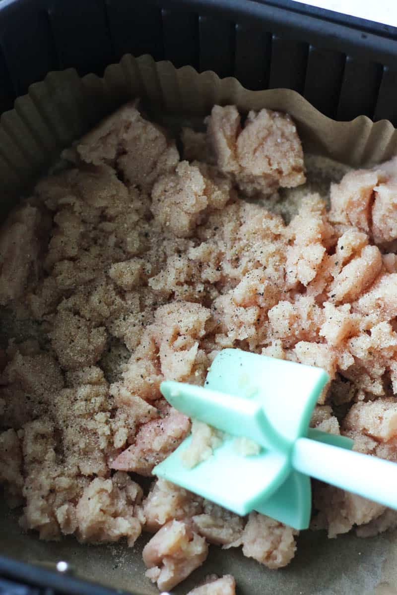 crumbling seasoned ground chicken in air fryer